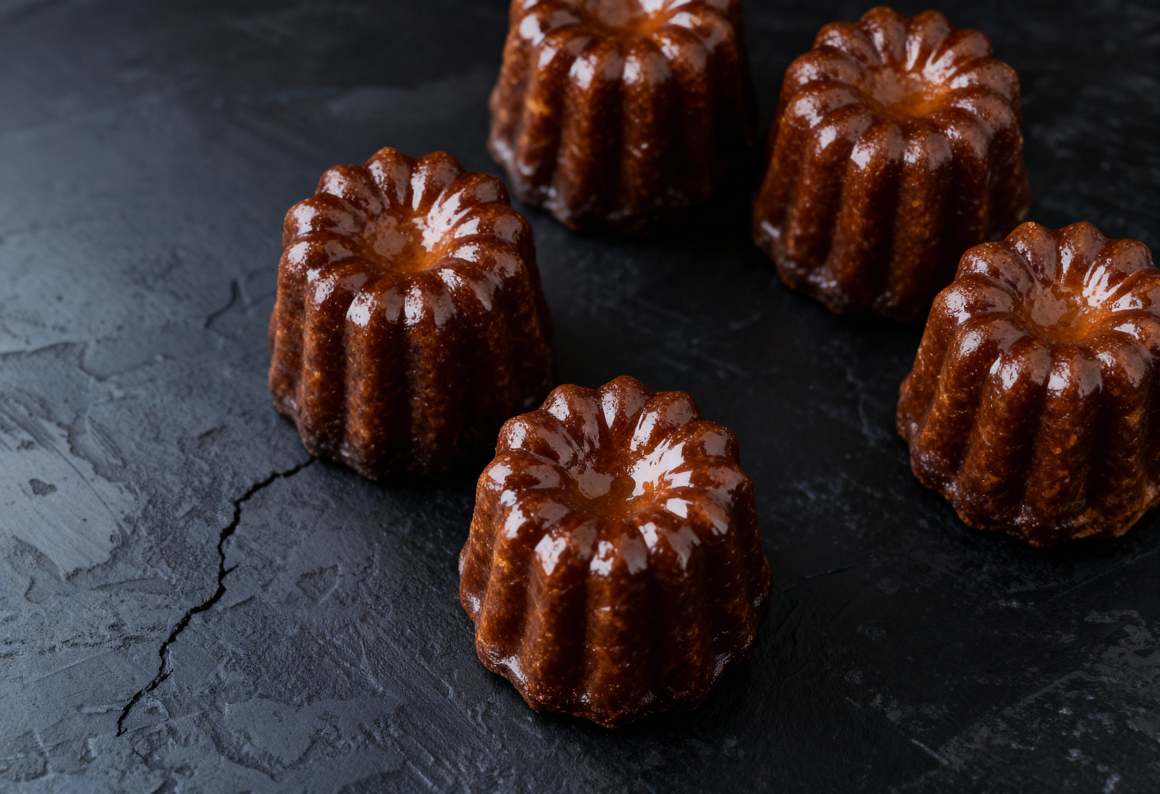 Canelés de Bordeaux, french rum cake from French Atelier Bakery, Venice, Florida.