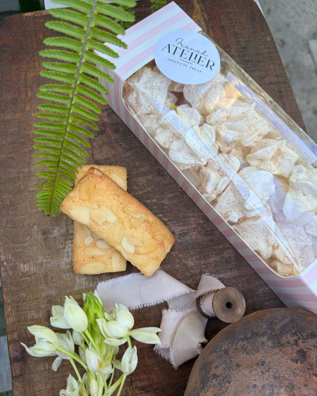 Mocha french meringues and financiers (almond cake) from the French Atelier, a French bakery in Venice Florida, available online, in Siesta Key farmers market and Venice Mercato. Delivery in Sarasota area.