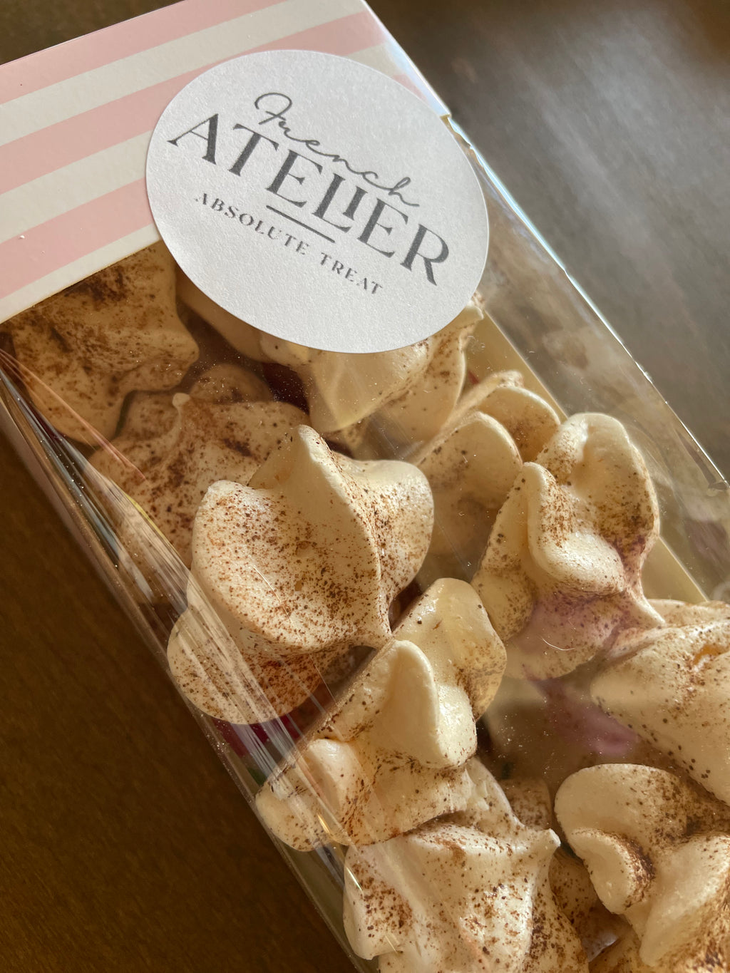 A bag of traditional French coffee meringues, freshly baked in Venice FL for local delivery in Venice or Sarasota, Florida or pickup on Siesta Key Farmers market or Venice Mercato market.From French Atelier,  french bakery in Venice Florida.
