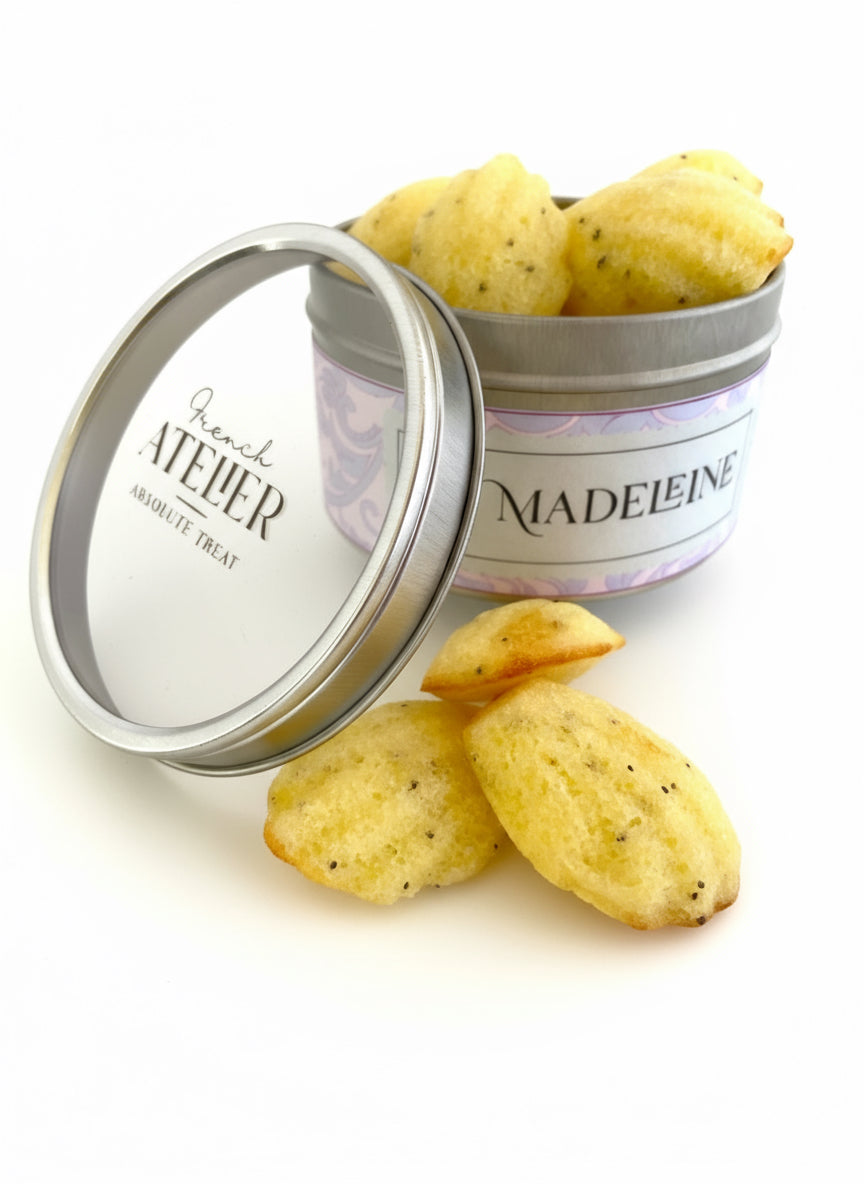 Open box of traditional French Madeleines with lemon and poppy seeds, artisanal astry from French Atelier Venice.